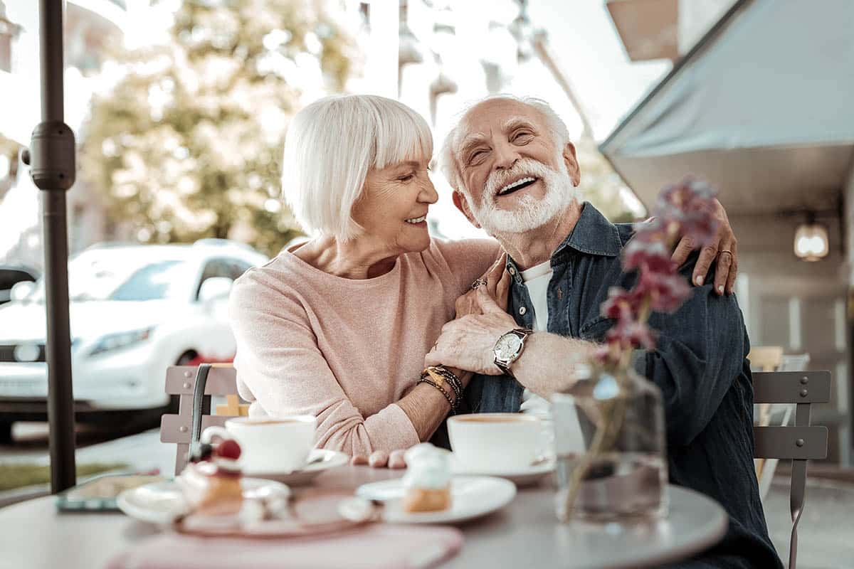 Pegasus Senior Living | Nice happy couple sitting together in the cafe