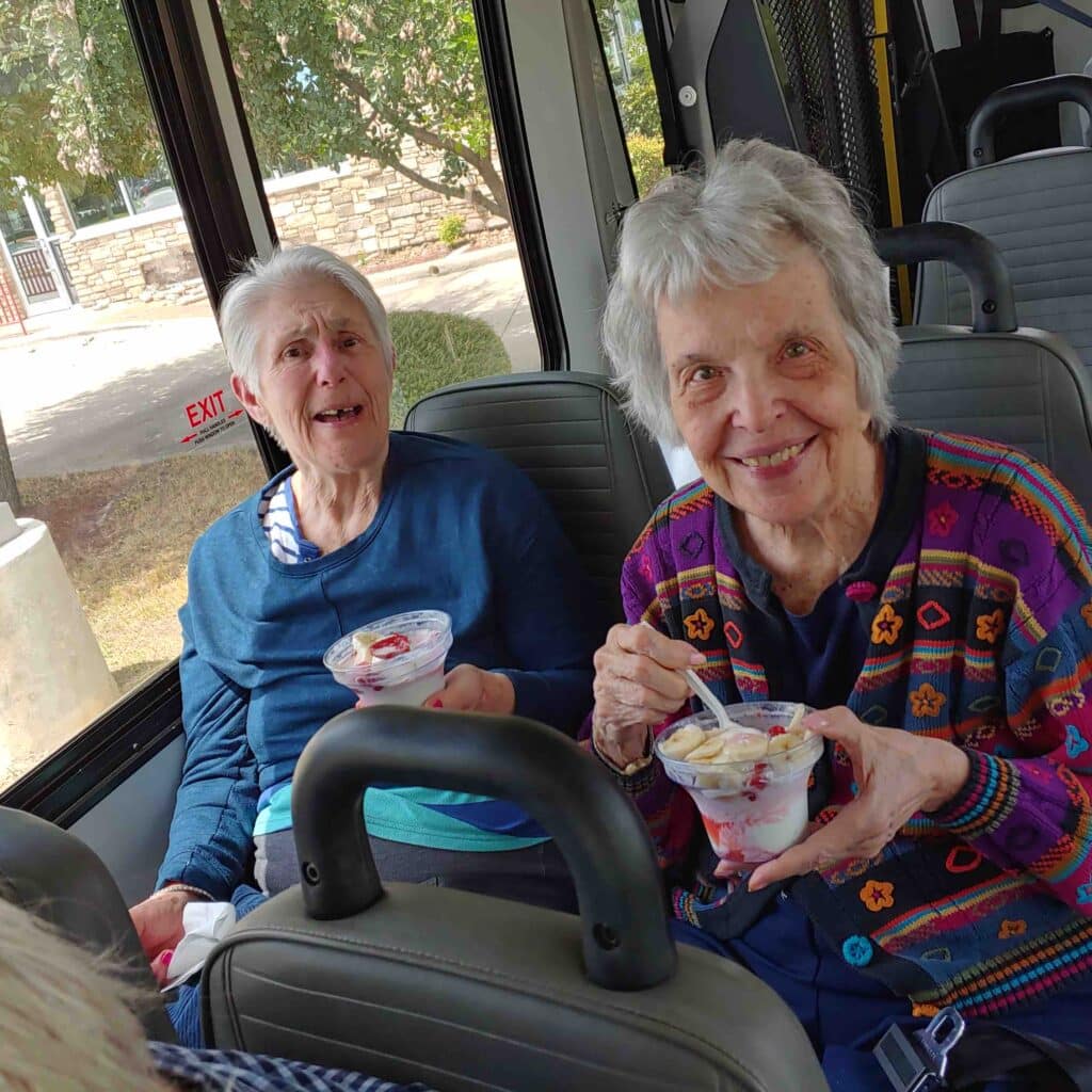 Parmer Woods at North Austin | Senior woman on bus eating ice cream