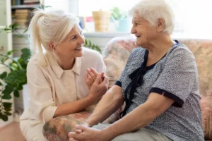 Family member comforting senior woman