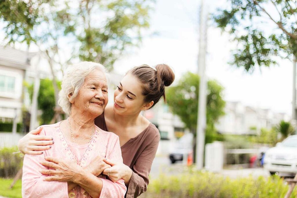 Pegasus Landing of Crystal Falls in Leander | Senior Woman And Adult Daughter Smiling and Hugging
