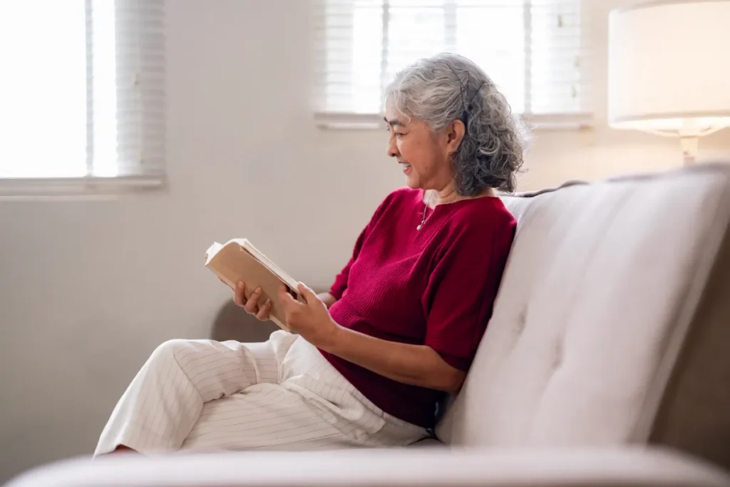 Senior woman reading and enjoying a peaceful morning