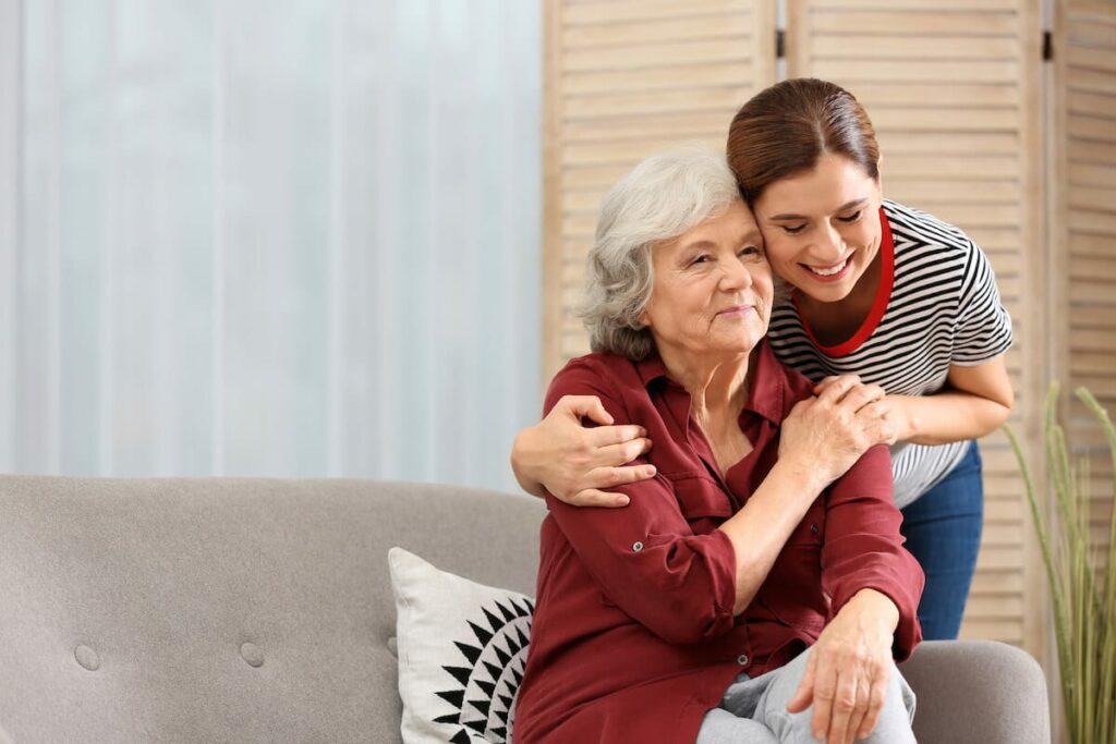 Pegasus Landing of Katy | Senior embracing caregiver