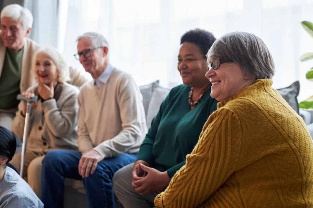 Pegasus Landing at Forest Ridge | Group of Smiling Senior Watching Television