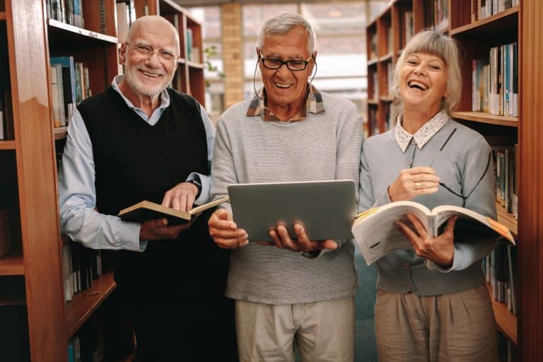 Pegasus Landing of Mesa | Seniors in library