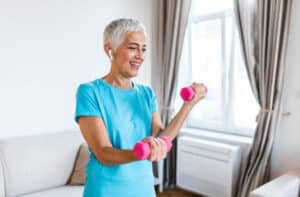 Pegasus Senior Living | Senior woman lifting weights