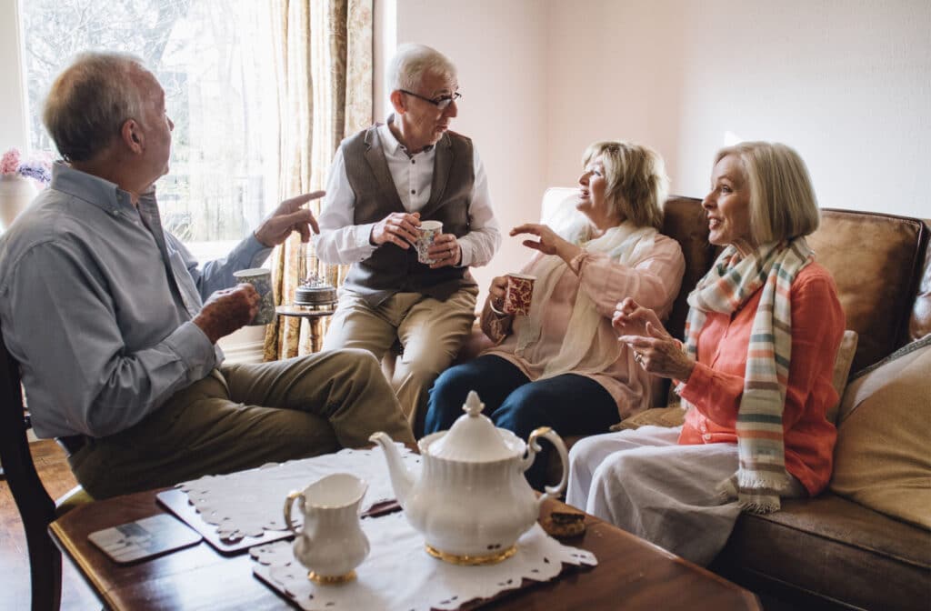 Pegasus Landing of South Plains | A group of seniors sitting a common room, enjoying a pot of tea and socializing