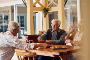 Seniors playing cards outside