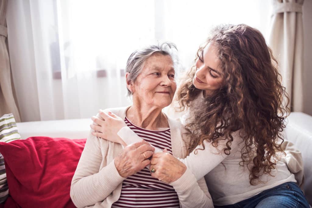Pegasus Landing of Town Square | Woman comforting grandmother