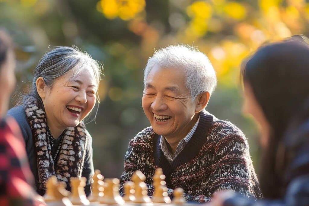 Pegasus Landing of Town Square | Happy Senior Couple Play Chess Outdoors