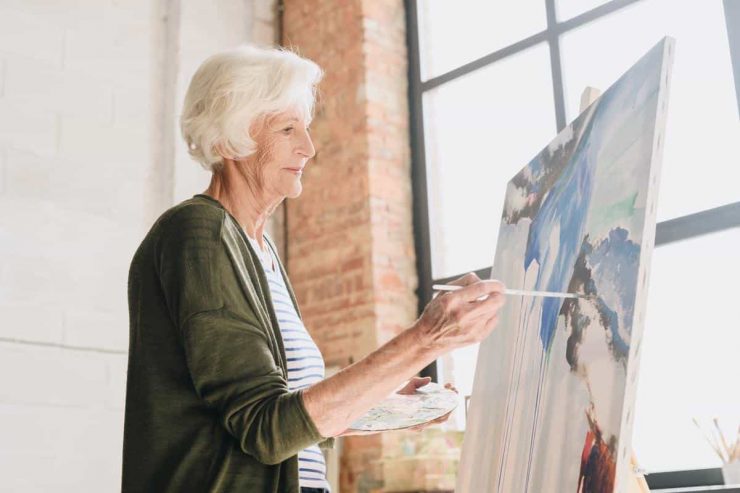 Pegasus Landing of Town Square | Senior woman painting