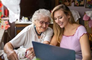 Pegasus Landing of Vintage Park | Senior woman and daughter reading on laptop