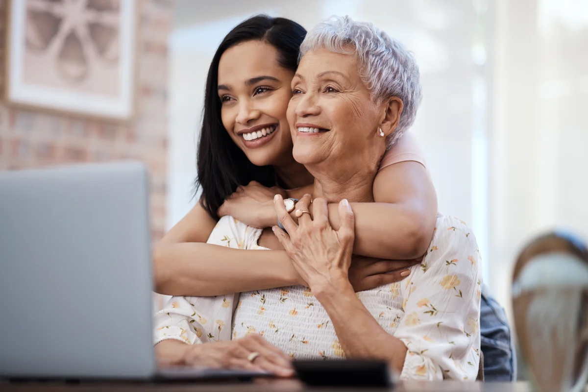 Senior and daughter looking at care options