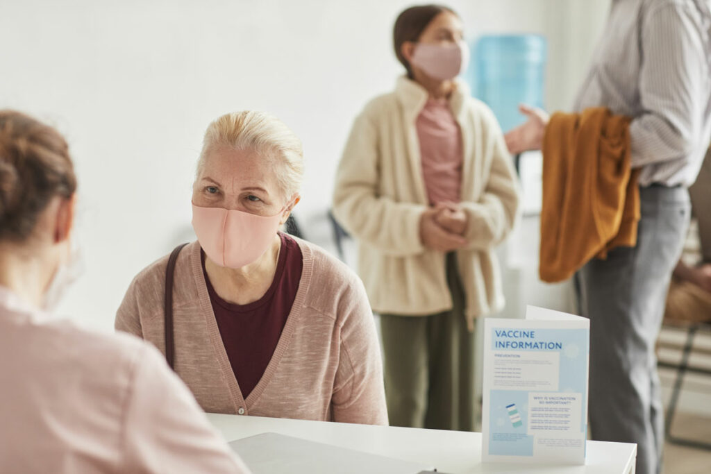 Pegasus Senior Living | Seniors read to receive their vaccines