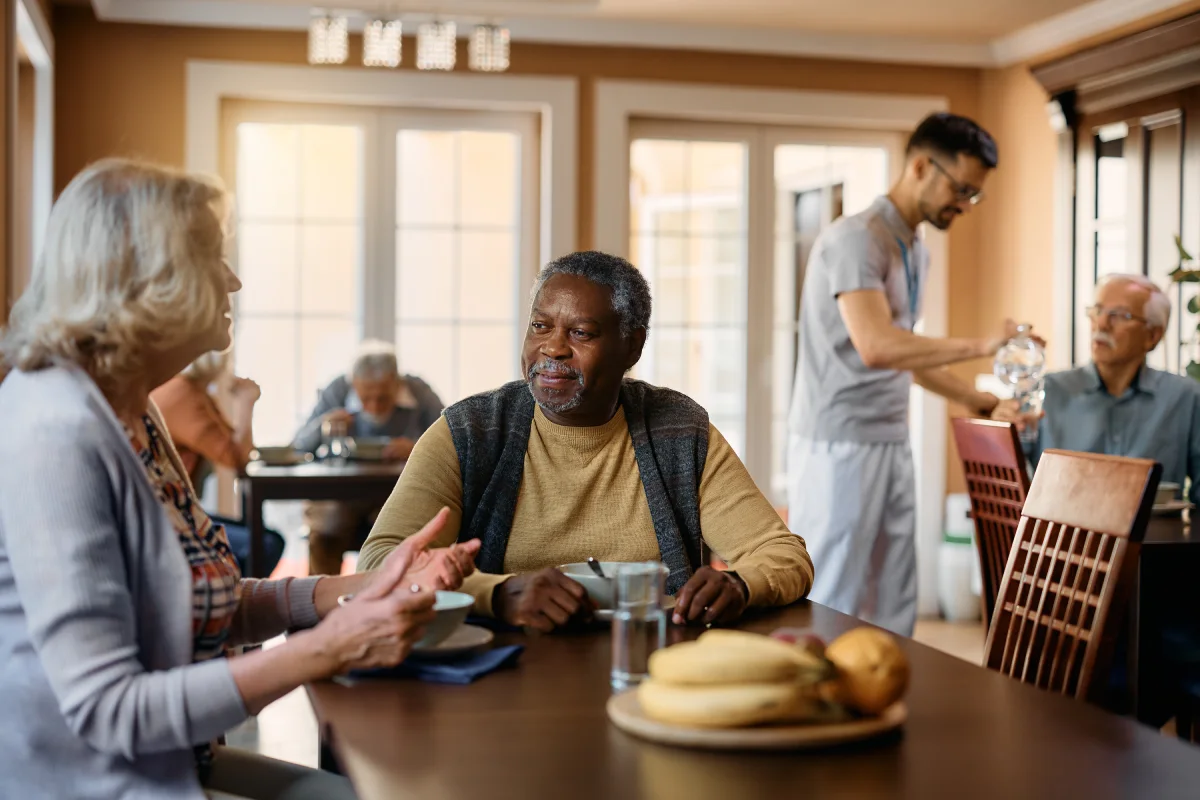 Seniors eating in dining room