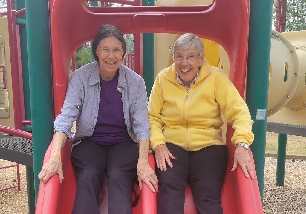 South Hill Village | Assisted living residents in Spokane going down a slide
