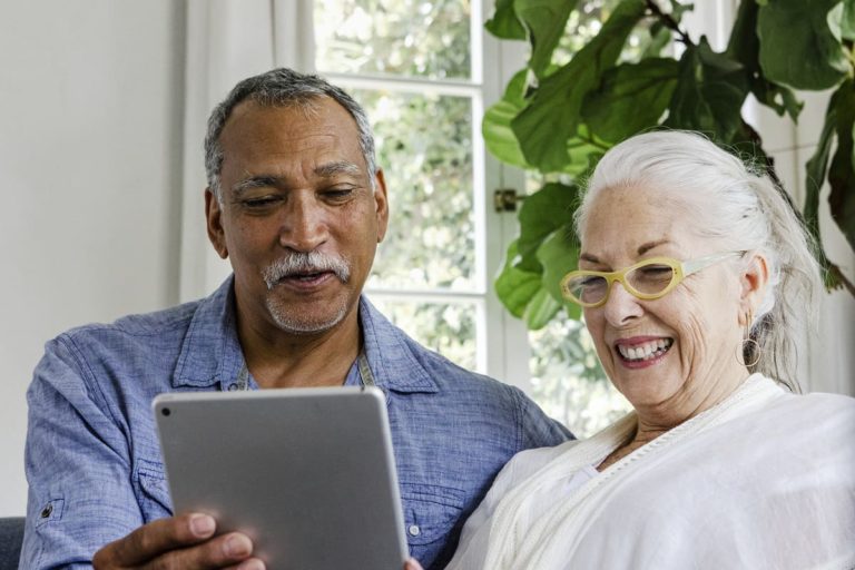 Sterling Court at Roseville | Happy seniors using tablet