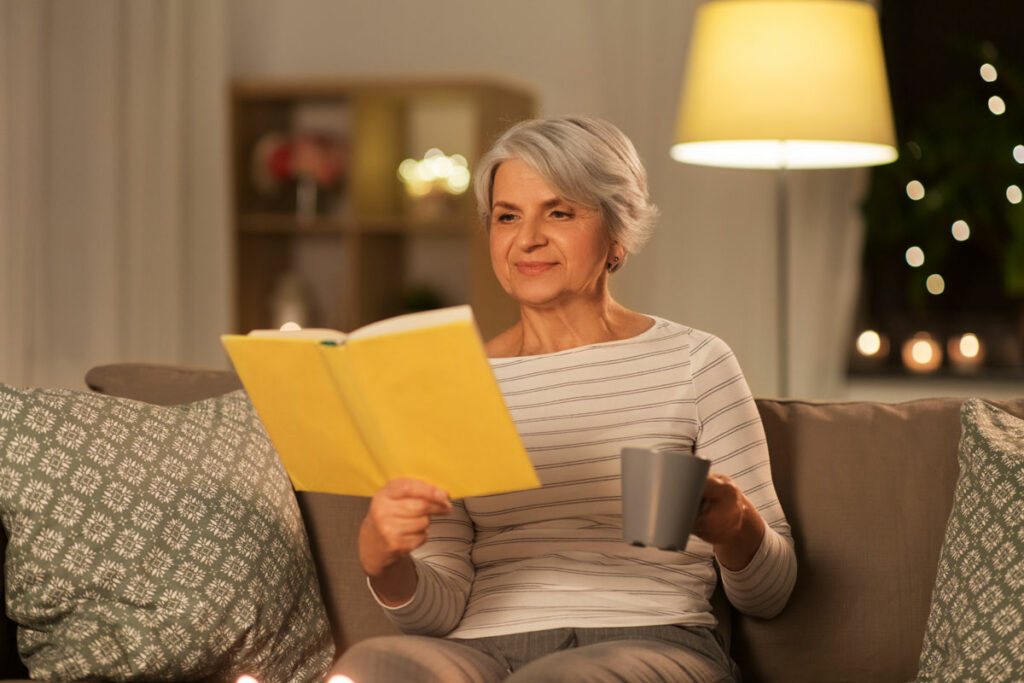 Sterling Court at Roseville | Senior woman reading at night