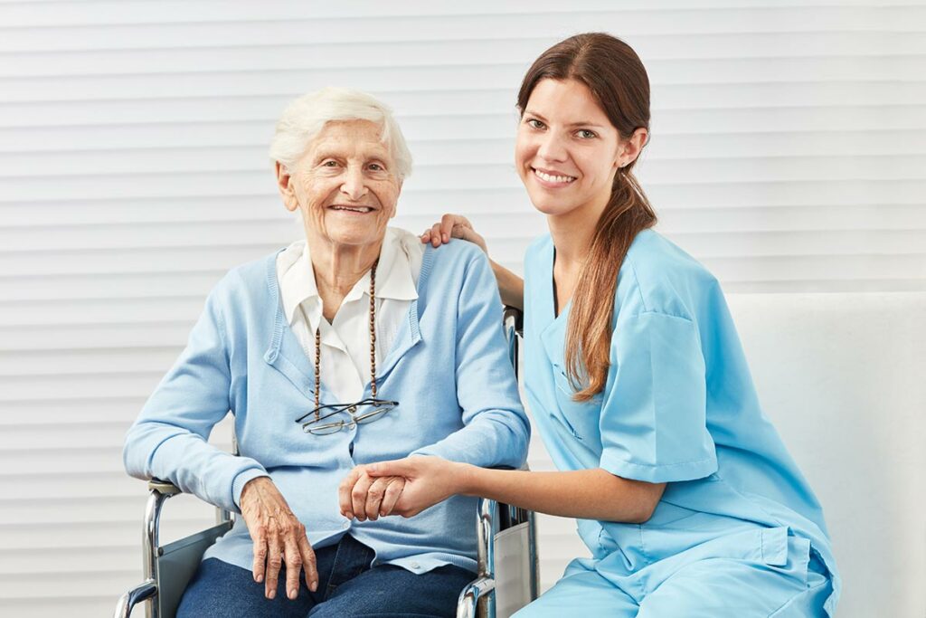 Sun City West | Senior woman and caregiver smiling