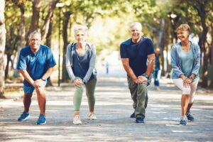Sun City West Assisted Living | Seniors outside stretching togther