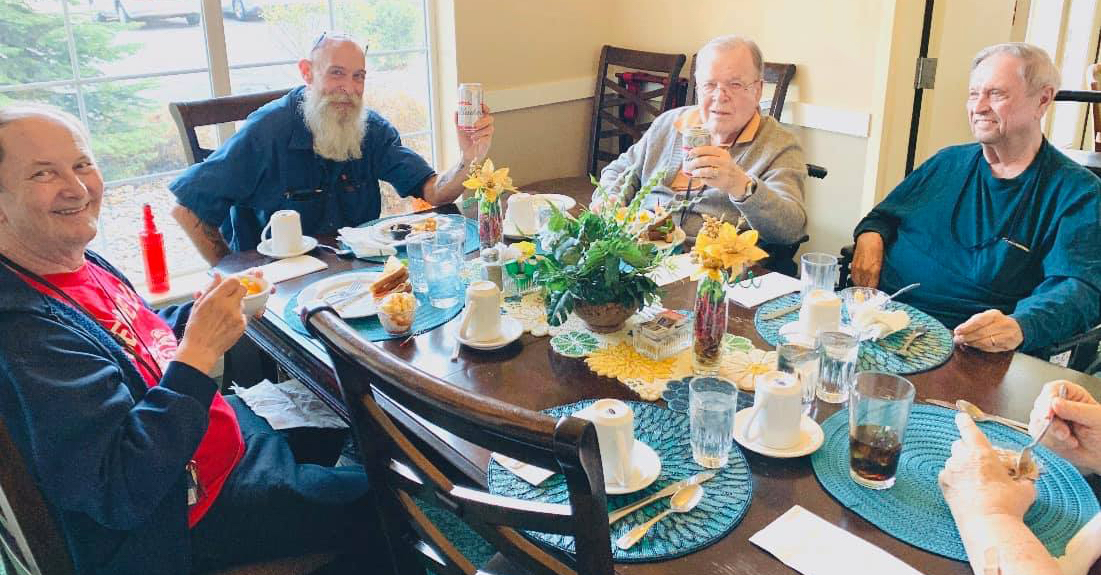 Pegasus Senior Living | Senior men at table
