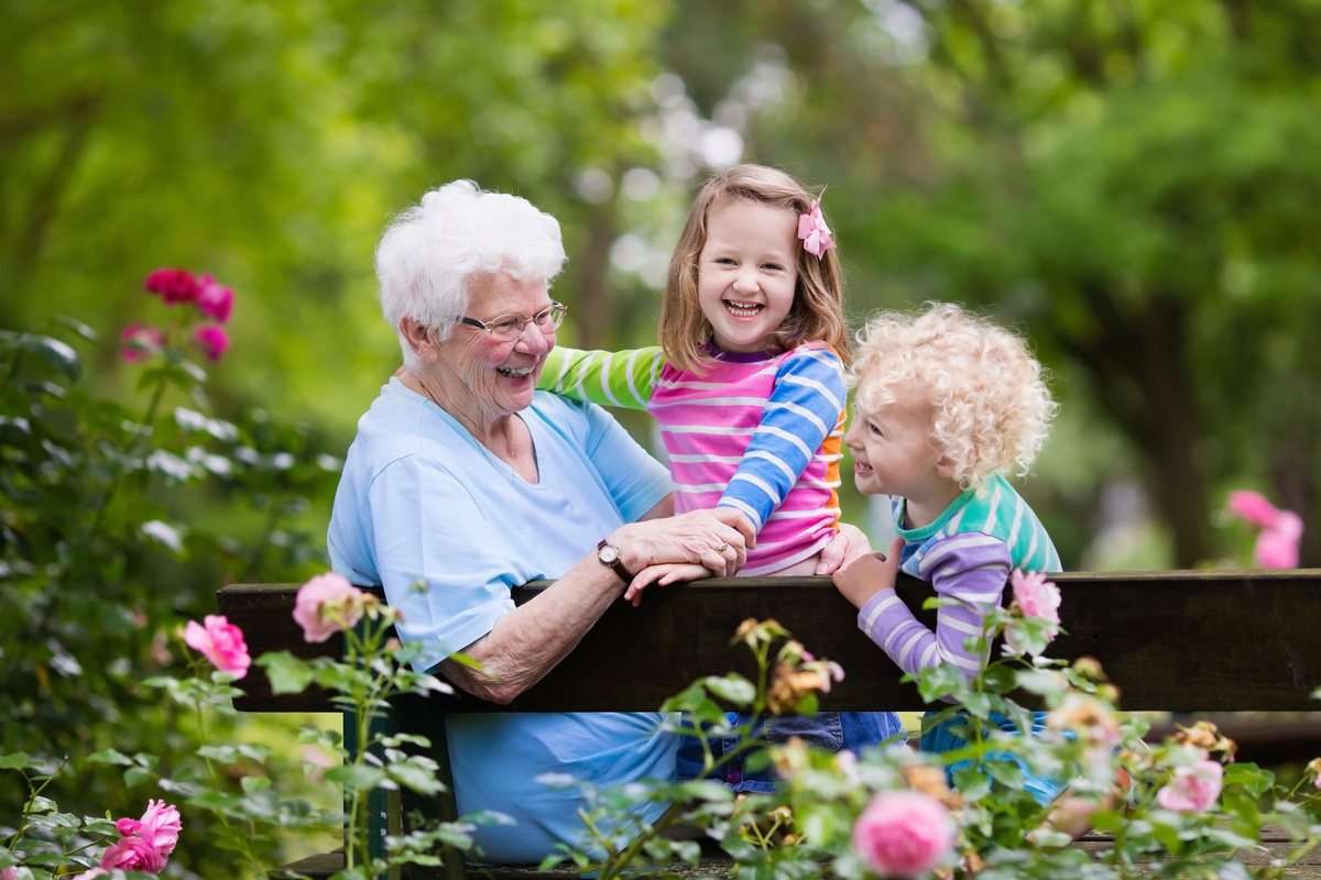 The Courtyards at Mountain View | Happy senior woman with grandchildren