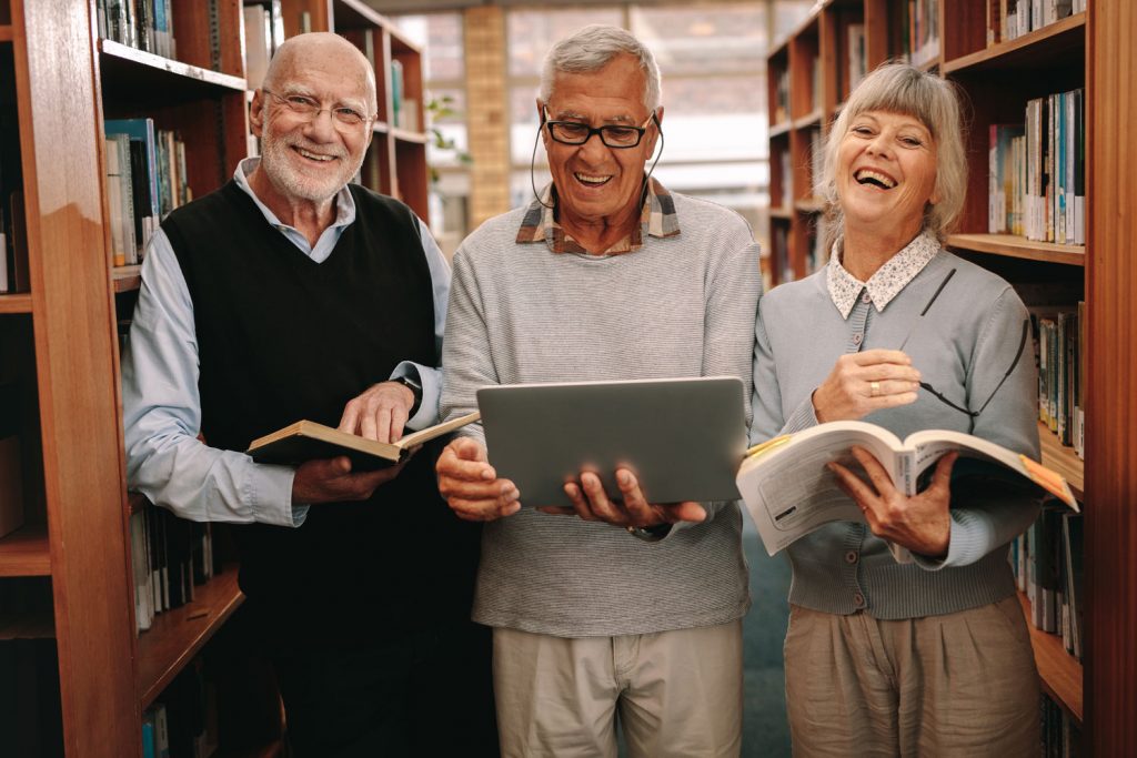 The Courtyards at Mountain View | Residents in library