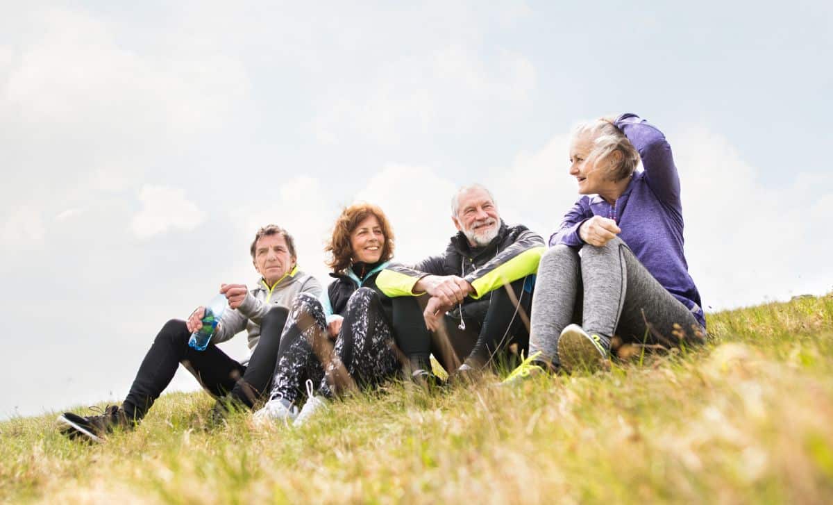 The Courtyards at Mountain View | Seniors sitting together on a hillside