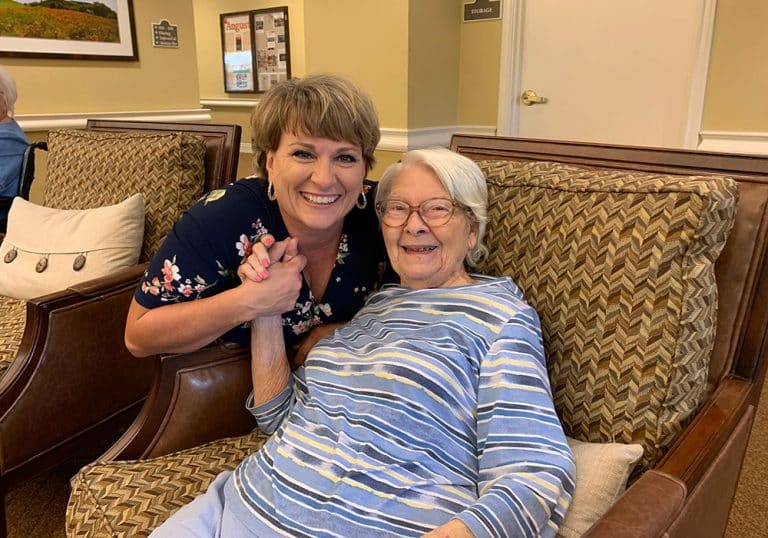 The Farrington at Tanglewood | Resident smiling with associate