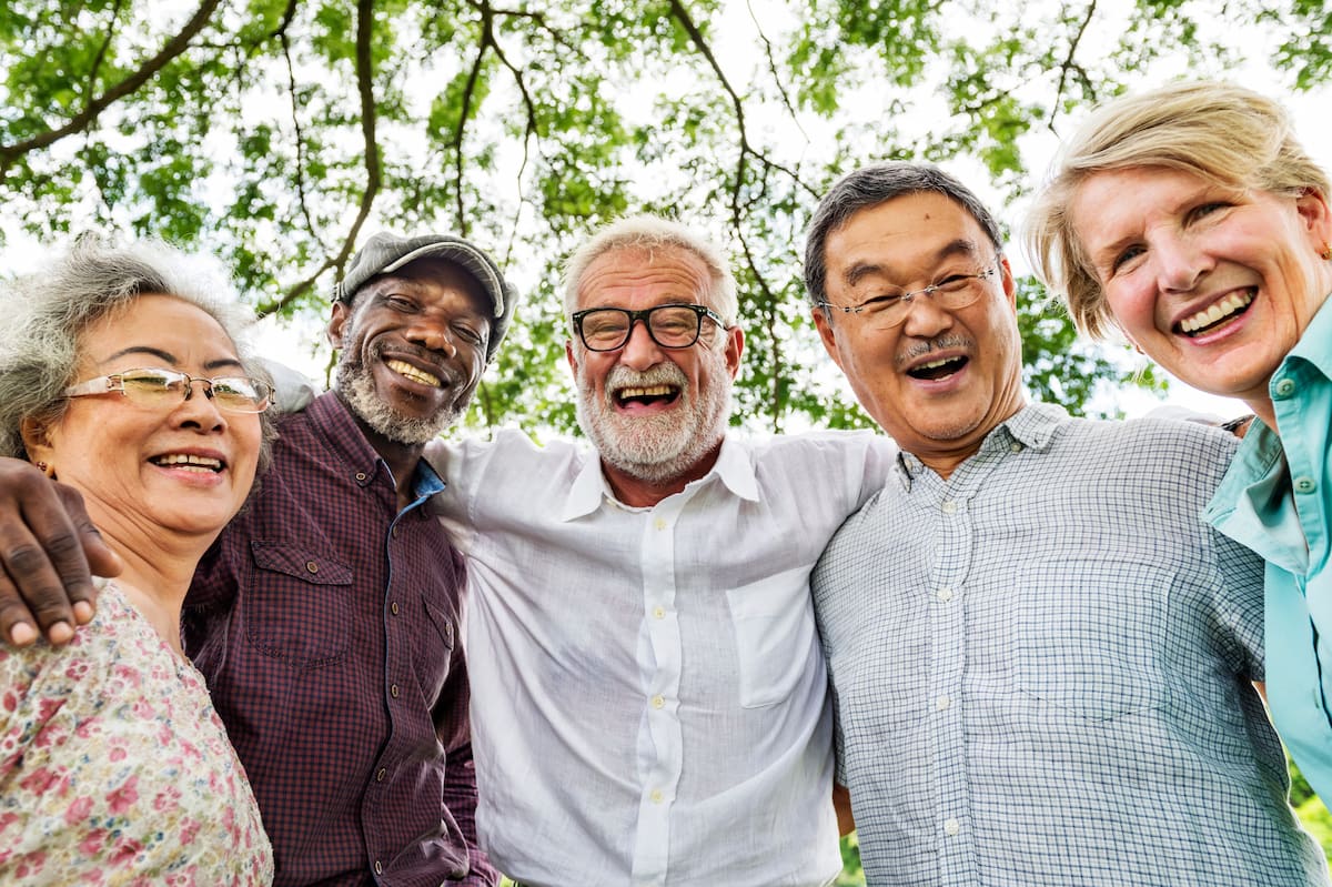 The Farrington at Tanglewood | Group of happy seniors huddled together outside