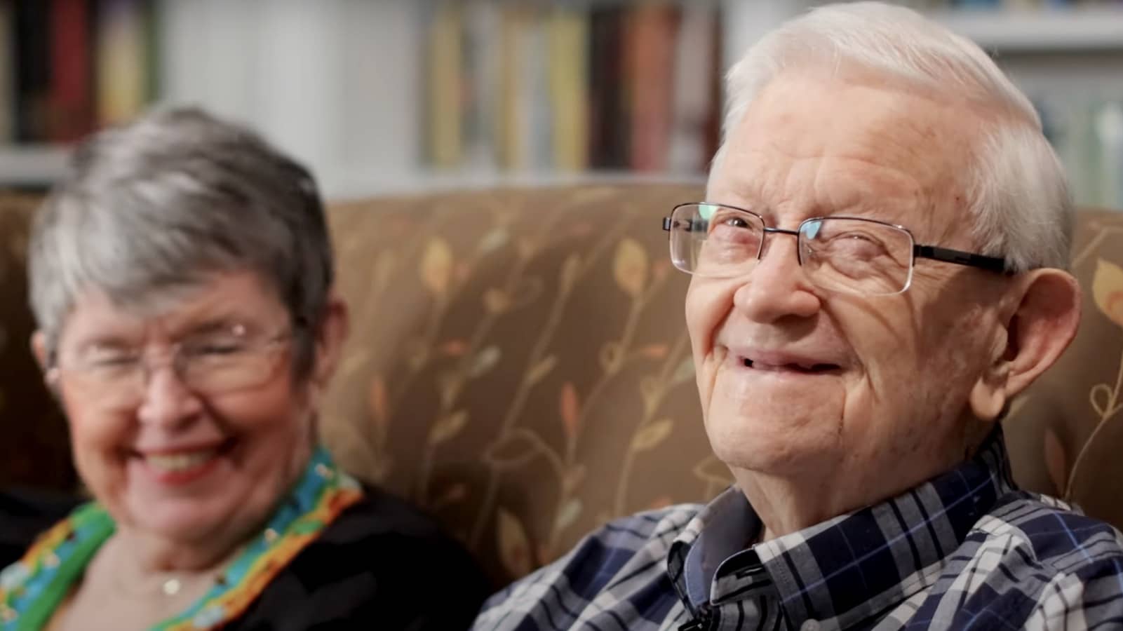 Pegasus Senior Living | Mr. Robert and wife laughing on a sofa