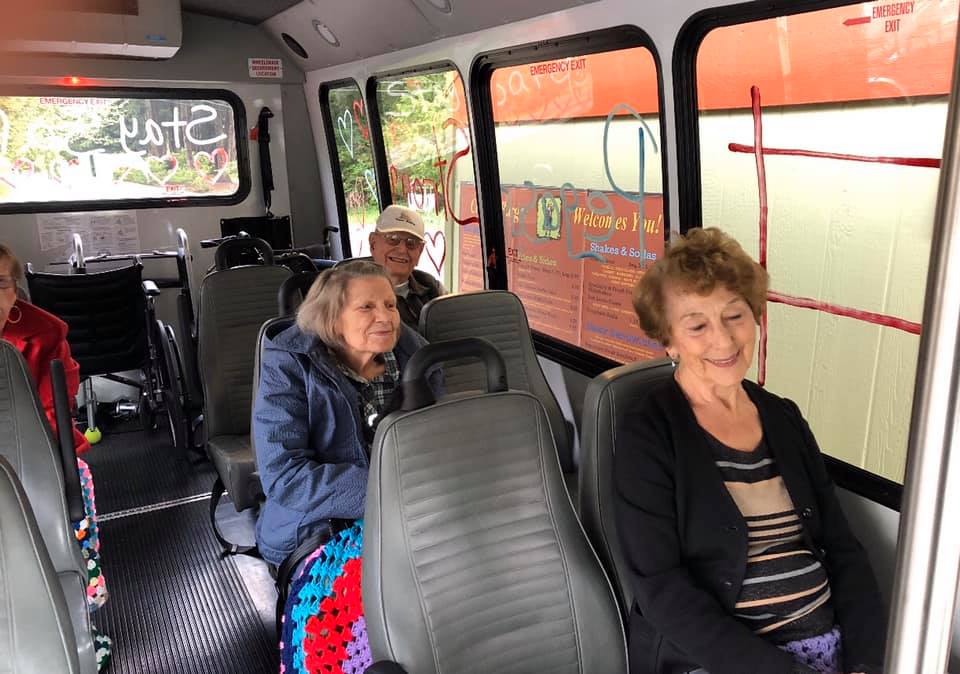 The Gardens at Marysville | Residents on bus at outing