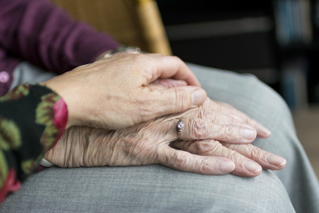 The Gardens at Marysville | Senior holding hands with caregiver