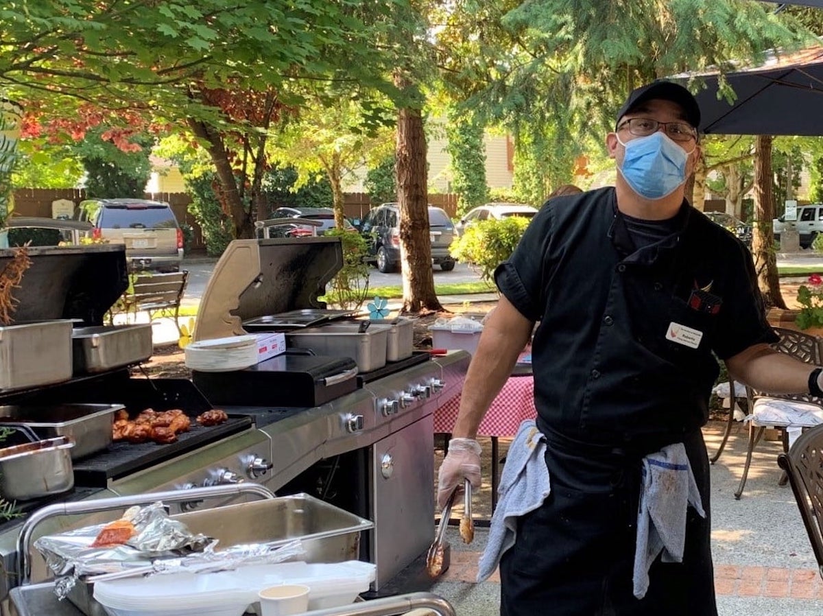 The Gardens at Marysville | Chef cooking lunch on the grill for residents