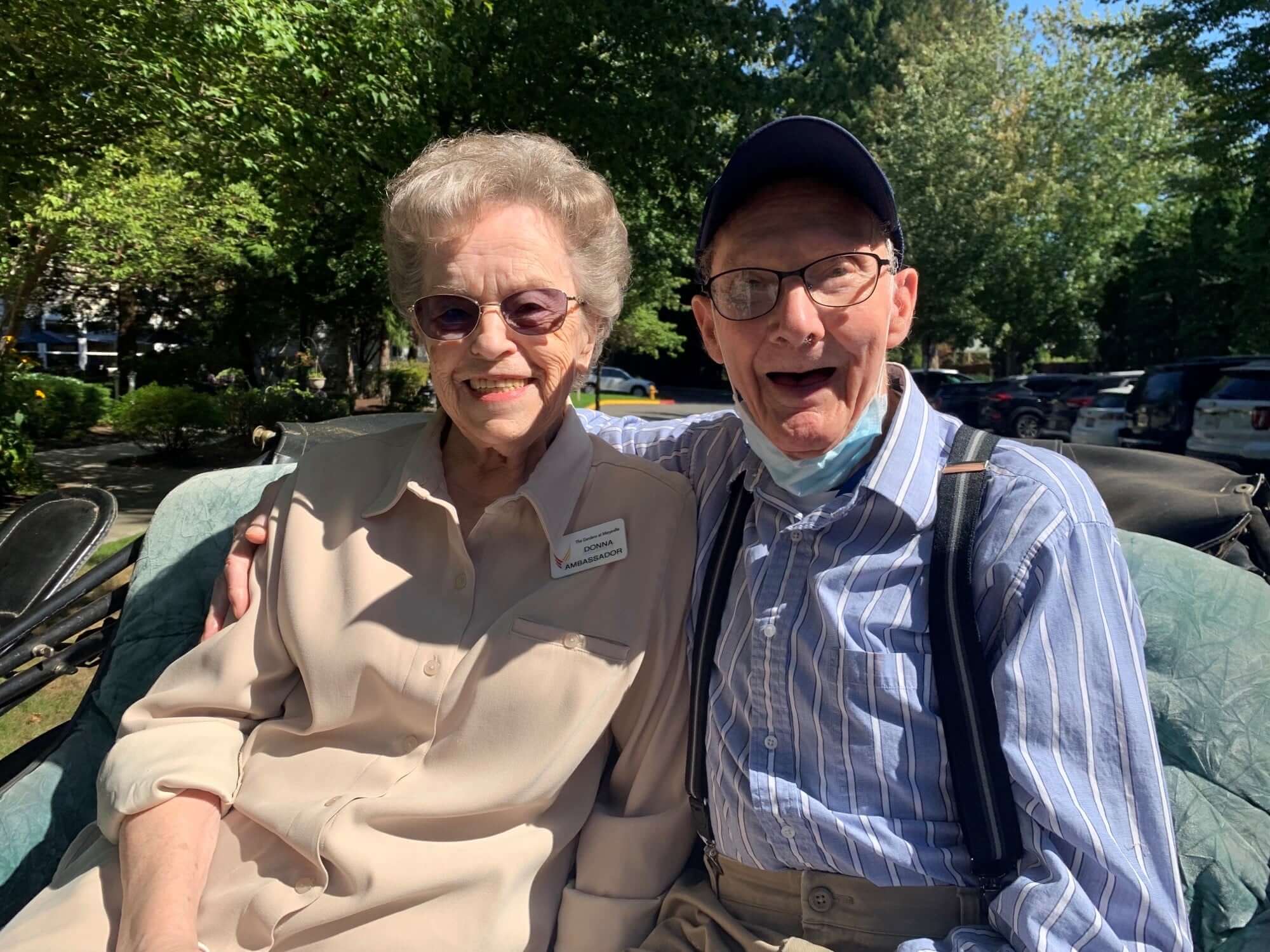 The Gardens at Marysville | Two residents sitting outside smiling and enjoying the outdoors