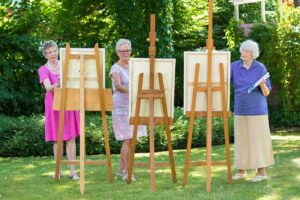 The Gardens at Marysville | Senior women at easels outdoors