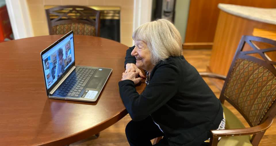 Pegasus Senior Living | Senior resident video chatting with family