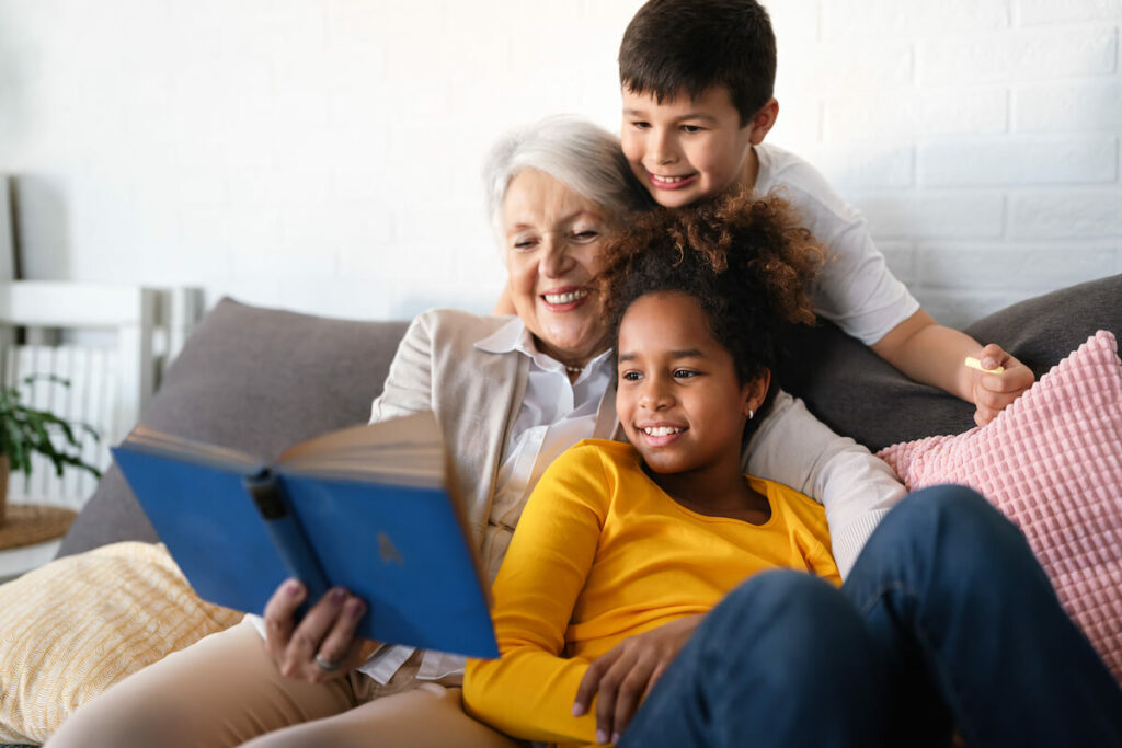 The Havens at Antelope Valley | Senior woman reading to children