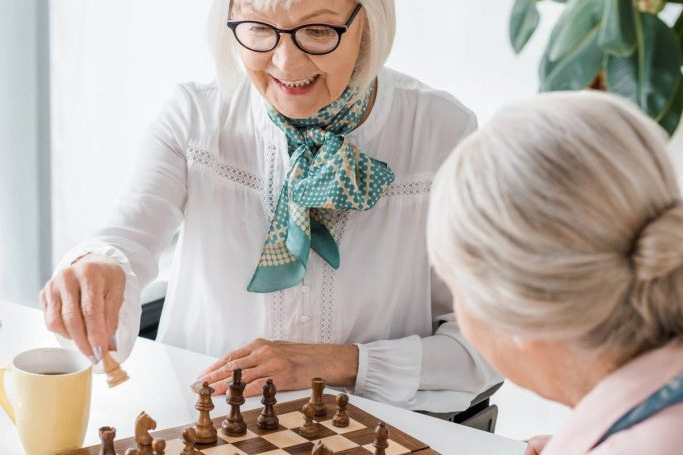 The Havens at Antelope Valley | Senior women playing chess