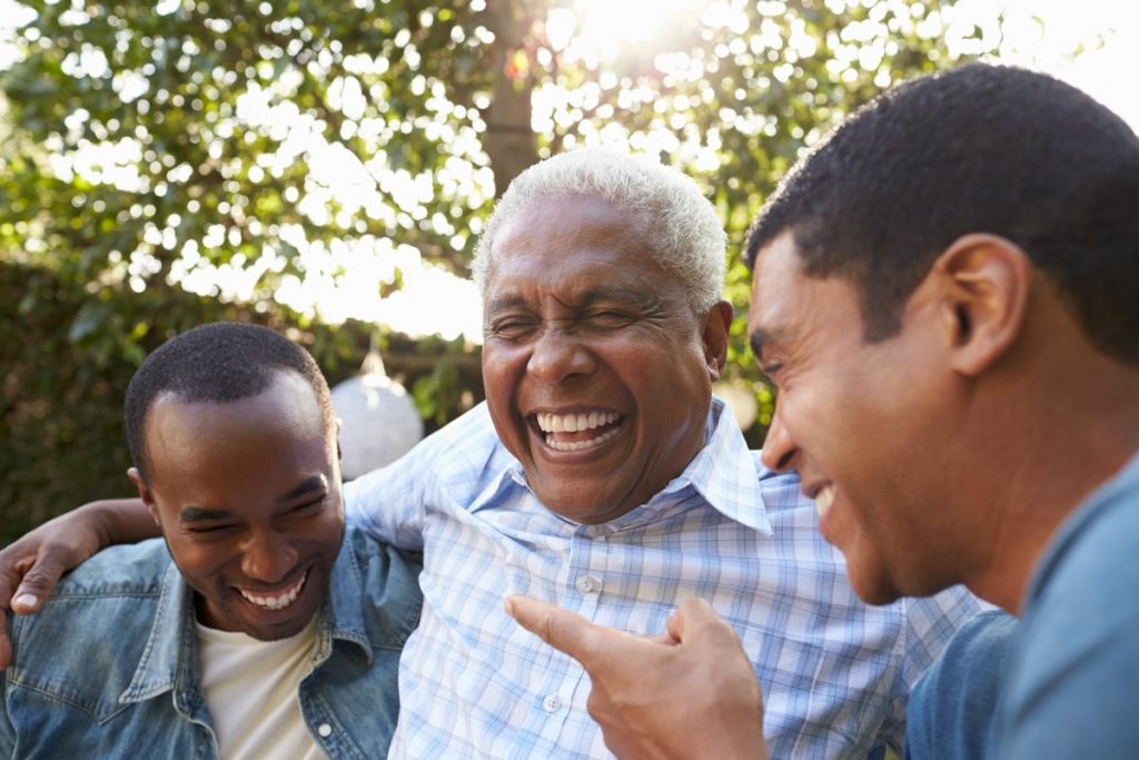 The Landing at Queensbury | Senior man laughing with family