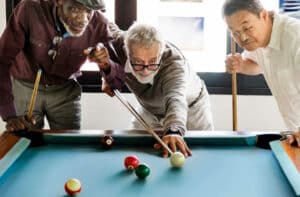 The Legacy at Cimarron in El Paso | Seniors playing pool