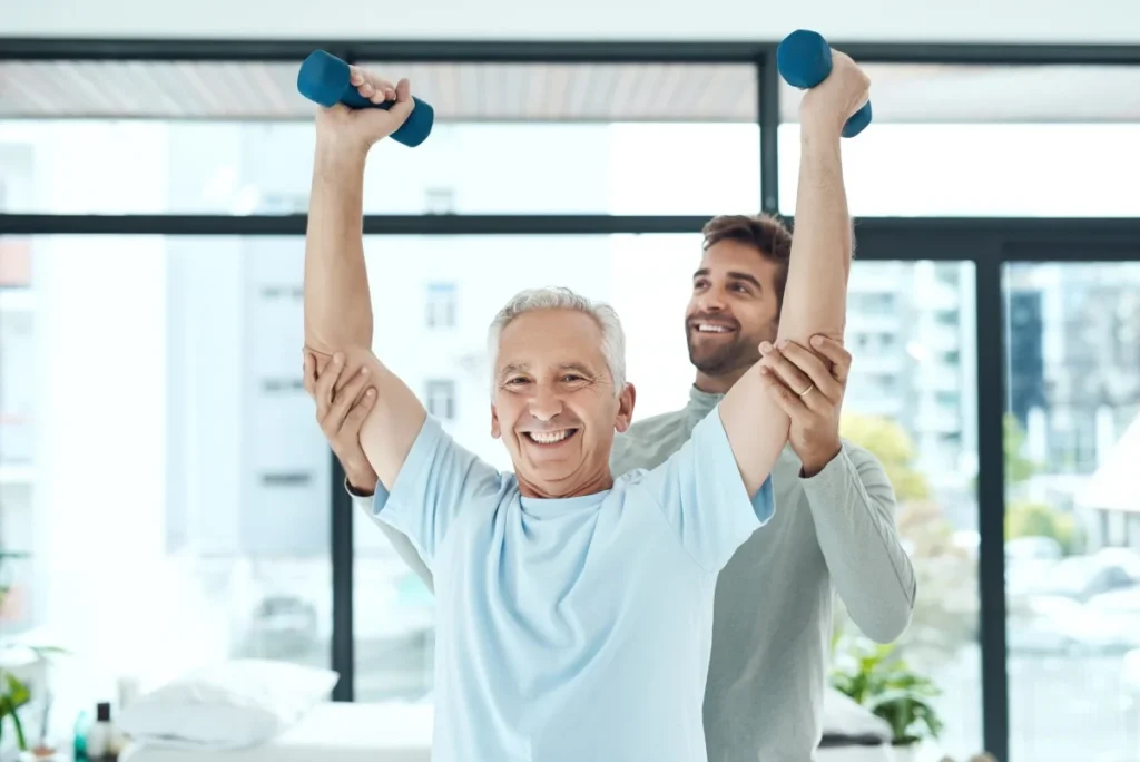 Senior exercising with help from a physical therapist