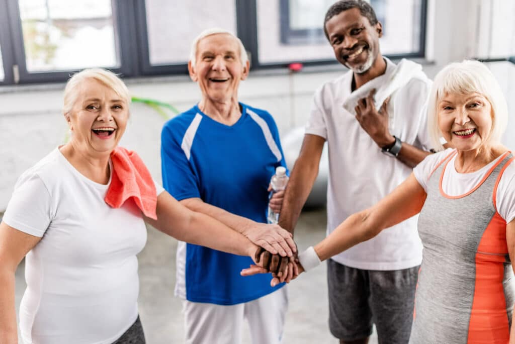 Pegasus Senior Living | Seniors huddled up after group activities