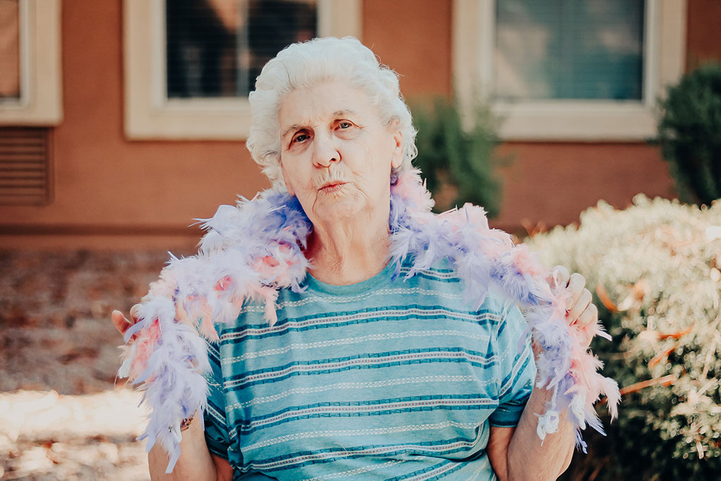 Pegasus Senior Living | Woman wearing boa