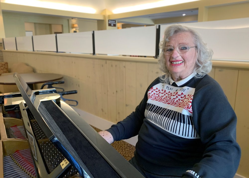 The Village at Rancho Solano | Senior woman playing piano
