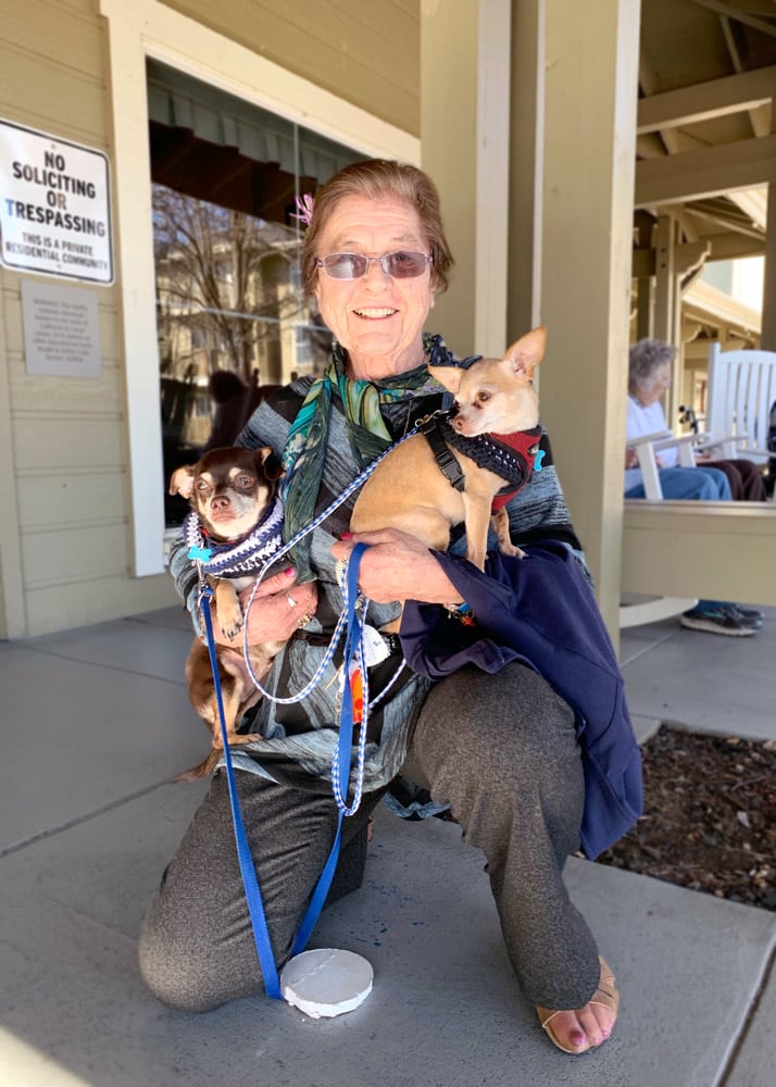 The Village at Rancho Solano | Resident holding dogs