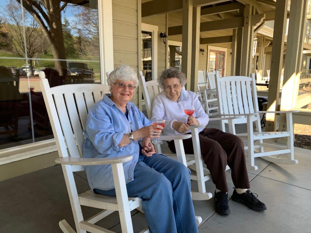 Pegasus Senior Living | Residents sitting on porch