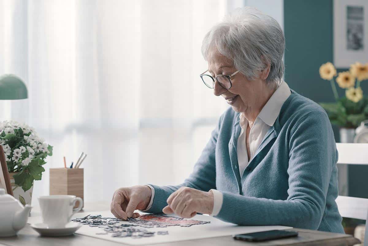 The Village at Rancho Solano | Elderly woman solves puzzle