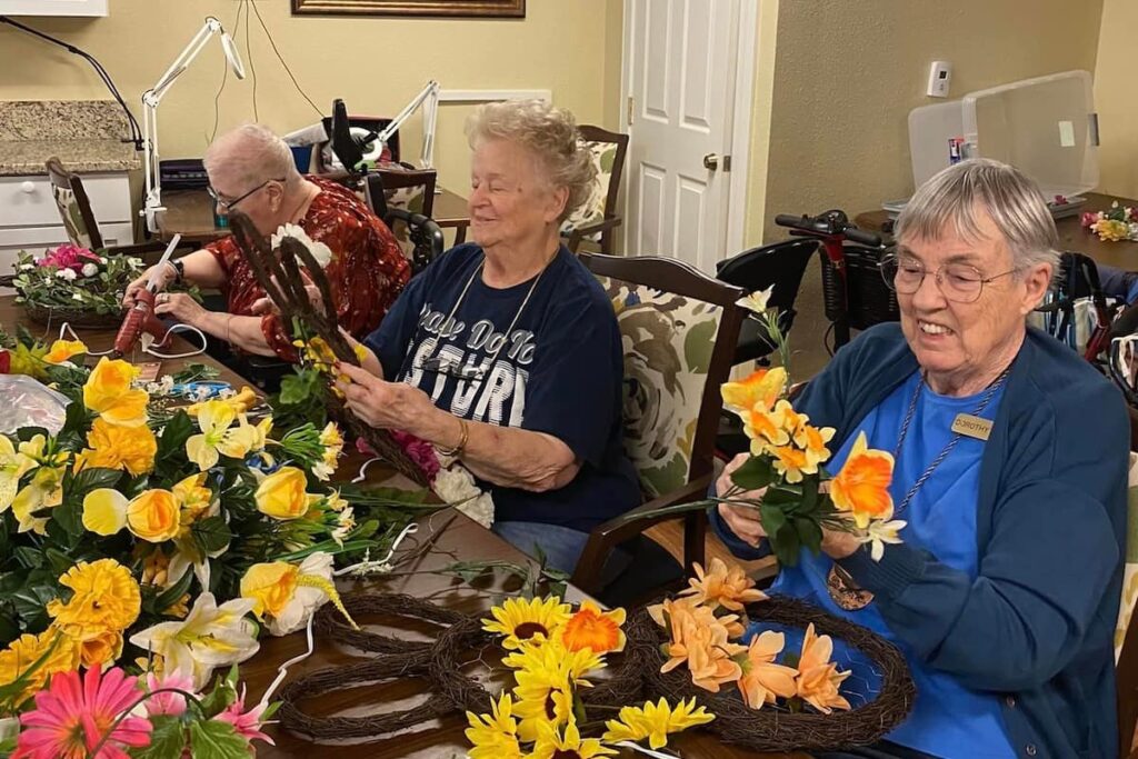 Town Village Crossing | Seniors doing activities with flowers
