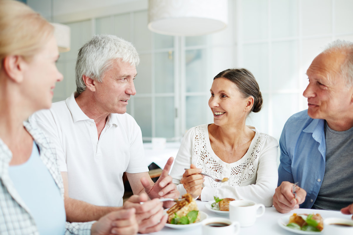 Town Village of Leawood | Happy seniors eating together