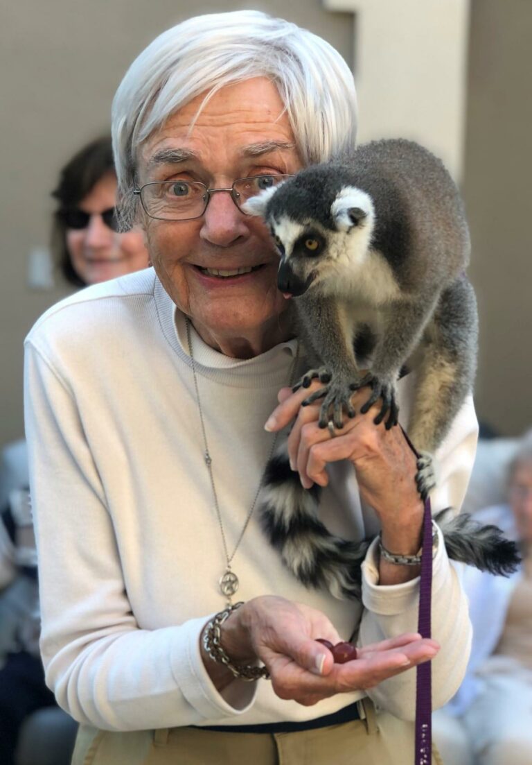 Town Village of Leawood | Resident with lemur